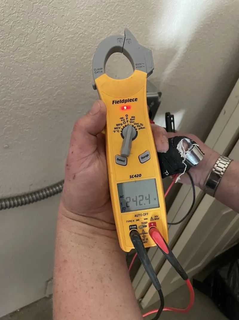 Voltage testing with clamp meter during Generator Installation in Otsego